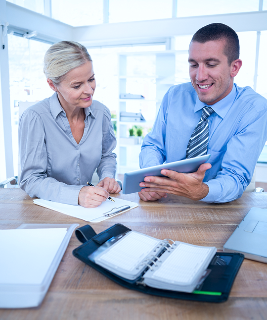 Men showing tablet to women img